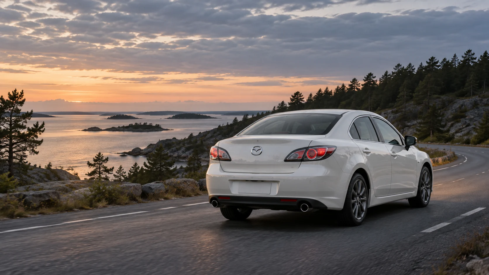 Tekoälyllä luotu havainnekuva valkoisesta Mazda6:sta pohjoismaisella rantatiellä.